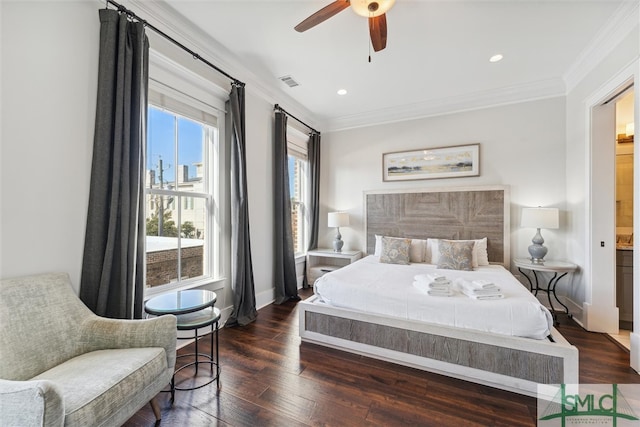 bedroom with ornamental molding, ensuite bath, ceiling fan, and dark wood-type flooring