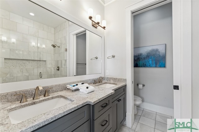 bathroom with tile patterned flooring, toilet, a shower with door, and vanity