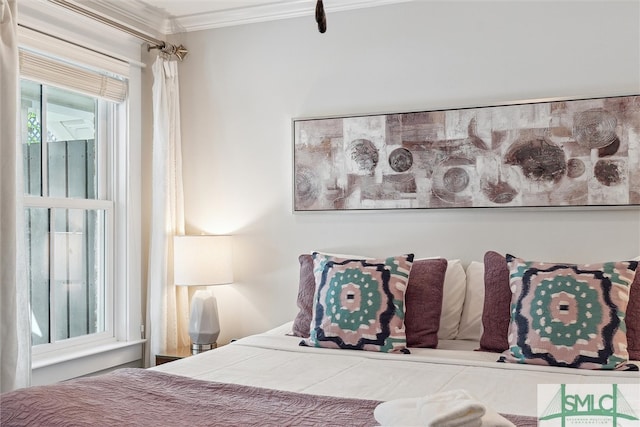 bedroom featuring crown molding