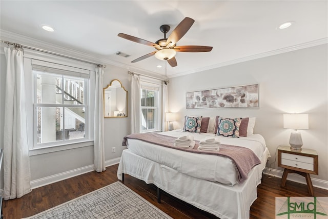 bedroom with ceiling fan, crown molding, and dark wood-type flooring