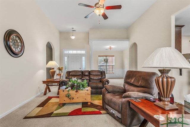 living room with ceiling fan and light colored carpet