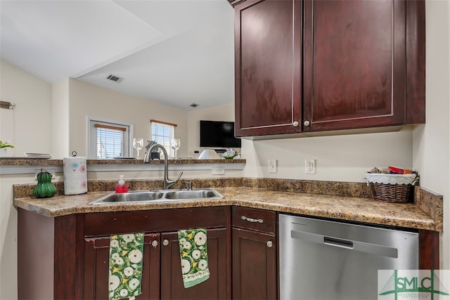 kitchen with lofted ceiling, sink, and dishwasher