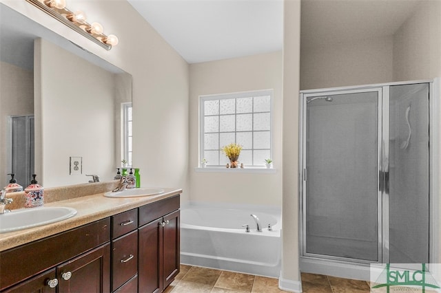 bathroom with tile patterned floors, separate shower and tub, and vanity