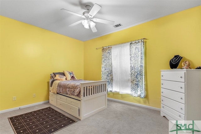 carpeted bedroom with ceiling fan