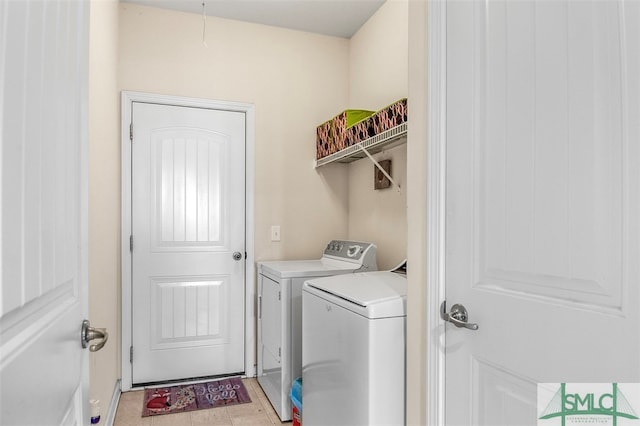 laundry room featuring washing machine and clothes dryer