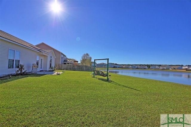 view of yard featuring a water view and a patio area