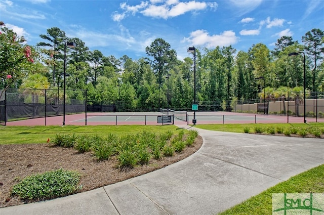 view of property's community with tennis court