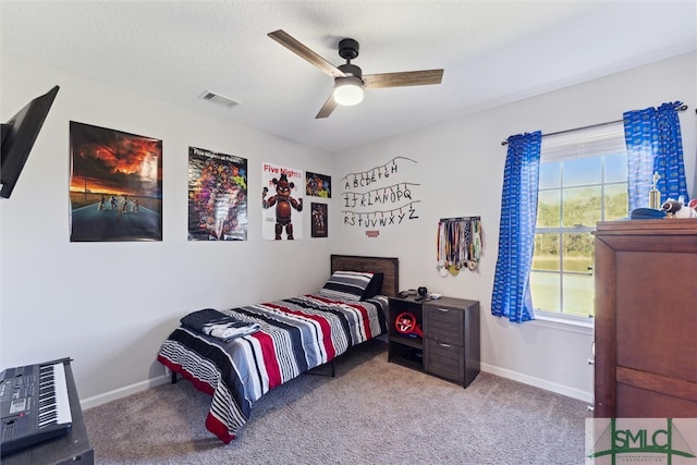 bedroom featuring light colored carpet and ceiling fan