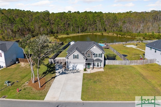 birds eye view of property with a water view