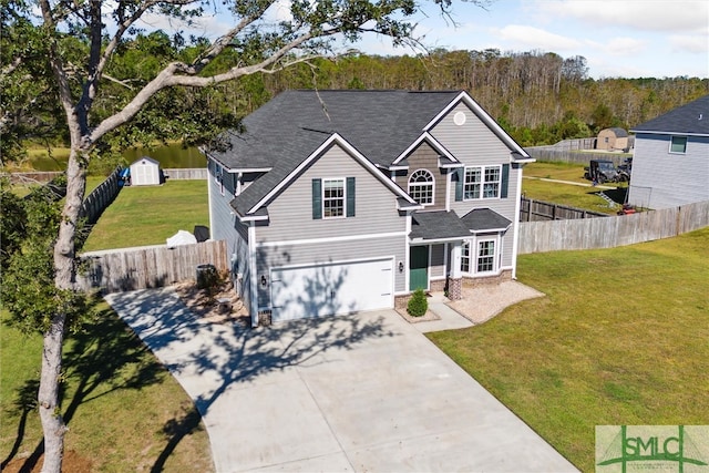 view of front facade featuring a garage and a front lawn