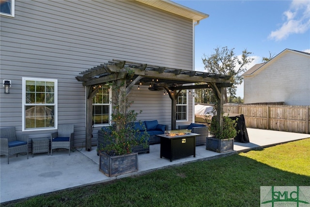 view of patio featuring a pergola and an outdoor living space with a fire pit