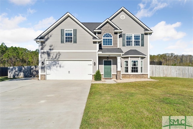 view of front of property featuring a front yard and a garage