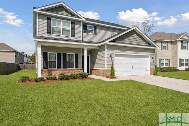 view of front of house with a garage, a front lawn, and covered porch