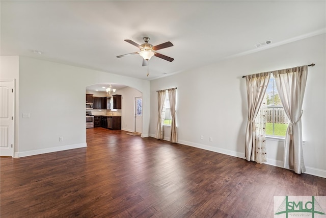 unfurnished living room with ceiling fan and dark hardwood / wood-style flooring