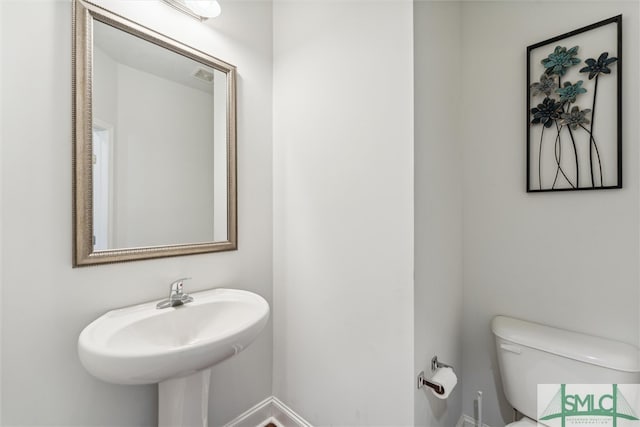 bathroom with sink and toilet