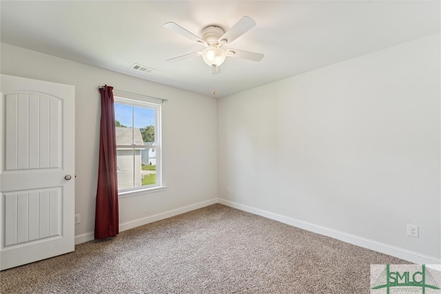 unfurnished room with carpet flooring and ceiling fan