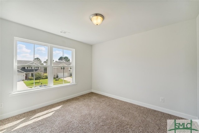 spare room with carpet flooring