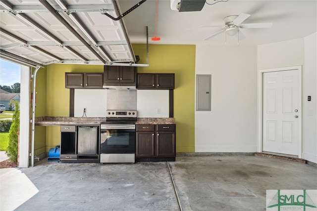 garage featuring ceiling fan, electric panel, and a garage door opener