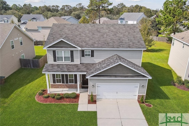 view of front facade featuring a garage and a front lawn