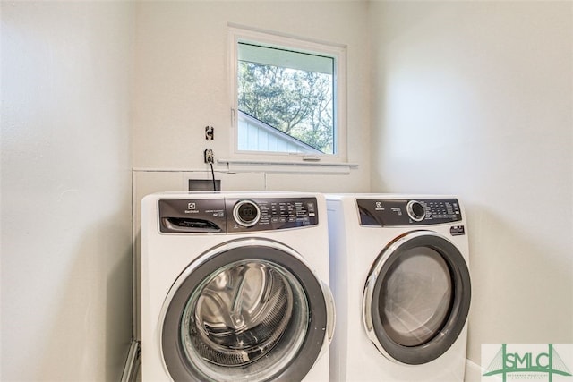 laundry area with washing machine and dryer