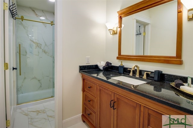 bathroom with walk in shower and vanity