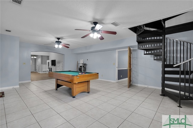 recreation room with pool table, light tile patterned floors, a textured ceiling, and ceiling fan