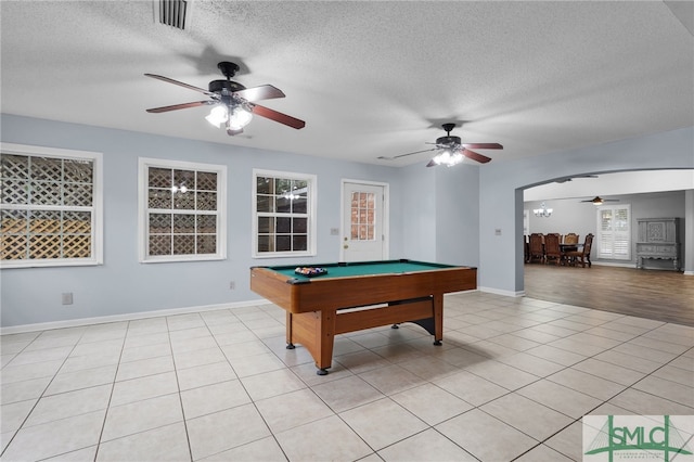 playroom featuring a textured ceiling, ceiling fan, light tile patterned flooring, and billiards