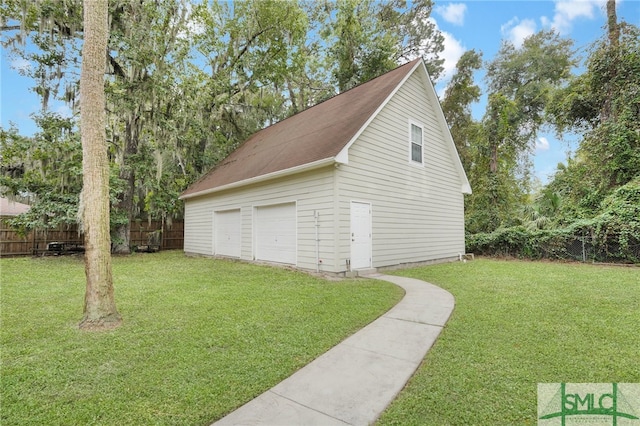 garage featuring a yard