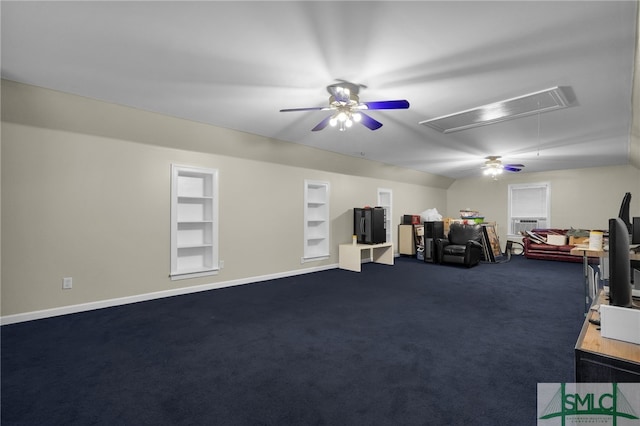 miscellaneous room with built in shelves, dark carpet, and ceiling fan