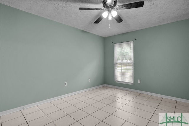 unfurnished room with ceiling fan, a textured ceiling, and light tile patterned flooring