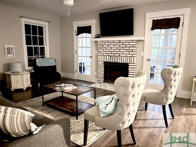 living room with a fireplace and hardwood / wood-style floors