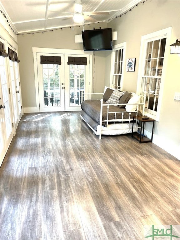 bedroom featuring access to outside, french doors, and hardwood / wood-style flooring