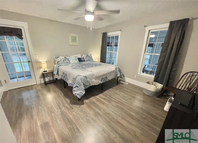 bedroom with ceiling fan and hardwood / wood-style floors