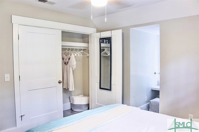 bedroom featuring ceiling fan, hardwood / wood-style flooring, and a closet