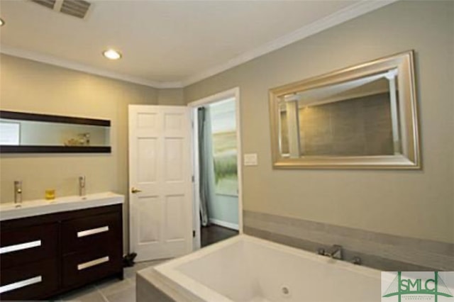 bathroom featuring vanity, a tub to relax in, tile patterned flooring, and ornamental molding