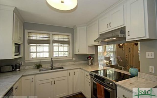 kitchen featuring white cabinets, stainless steel appliances, sink, and a healthy amount of sunlight