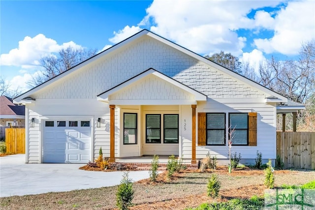 view of front facade featuring a porch and a garage