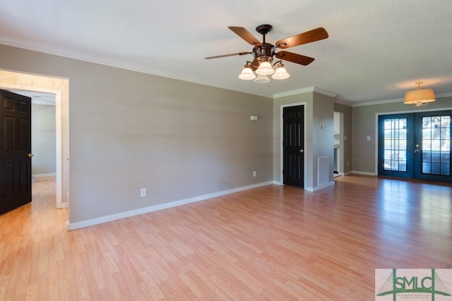 159 E 1st St, Midway, GA 31320 - unfurnished living room featuring light wood-style flooring, french doors, ceiling fan, and crown molding