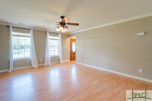 159 E 1st St, Midway, GA 31320 - empty room with a textured ceiling, ceiling fan, crown molding, and light wood finished floors