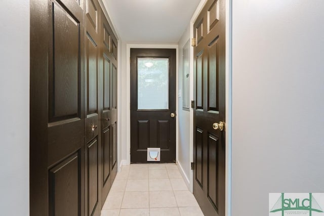 159 E 1st St, Midway, GA 31320 - entryway with light tile patterned flooring and baseboards