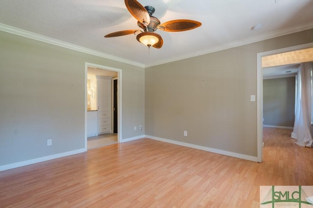 159 E 1st St, Midway, GA 31320 - empty room with light wood-style flooring, a ceiling fan, and crown molding