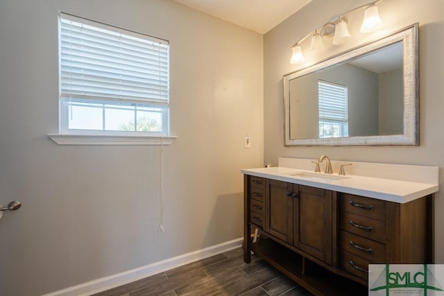 159 E 1st St, Midway, GA 31320 - bathroom featuring vanity and wood finished floors