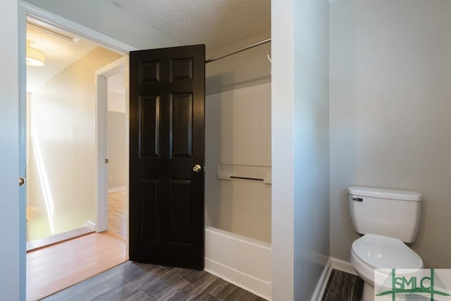 159 E 1st St, Midway, GA 31320 - bathroom featuring wood finished floors and a textured ceiling