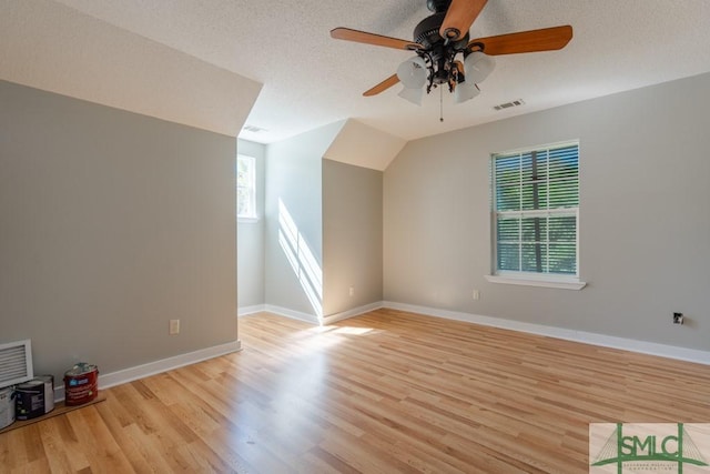 159 E 1st St, Midway, GA 31320 - additional living space with a ceiling fan, light wood finished floors, and a textured ceiling