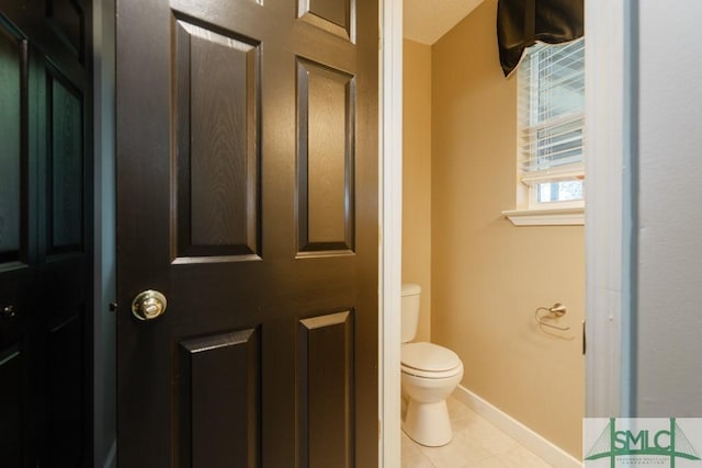 159 E 1st St, Midway, GA 31320 - bathroom featuring toilet and tile patterned flooring