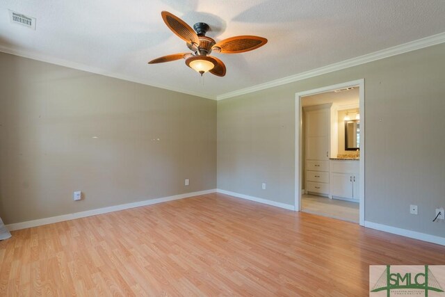 159 E 1st St, Midway, GA 31320 - spare room with ceiling fan, light wood-type flooring, and crown molding