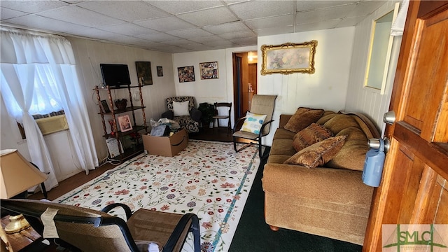 living room with a drop ceiling