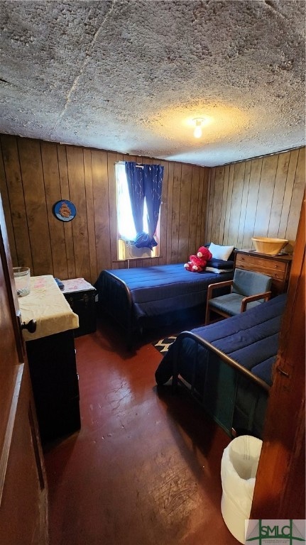 bedroom with wood walls