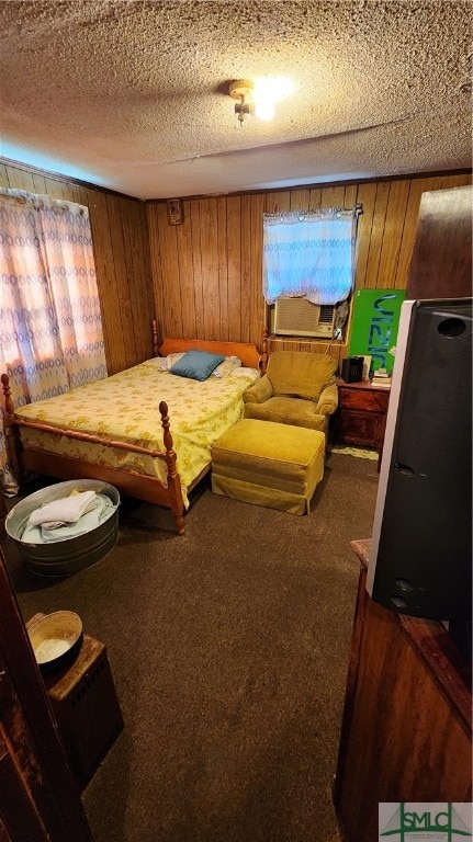 carpeted bedroom featuring cooling unit, a textured ceiling, and wooden walls