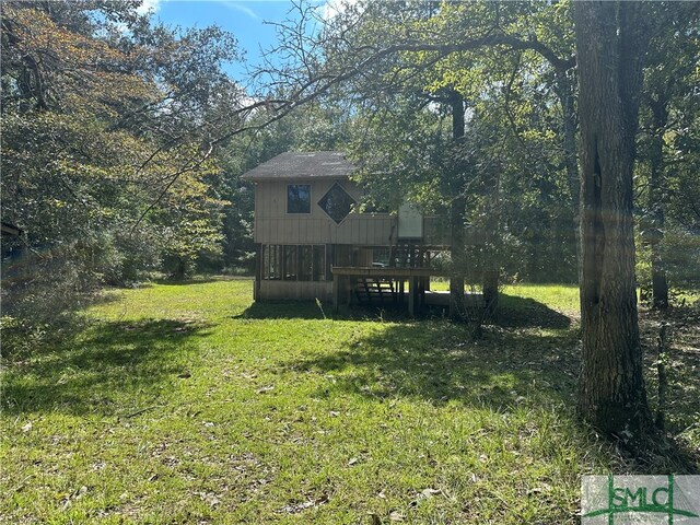 view of yard with a wooden deck